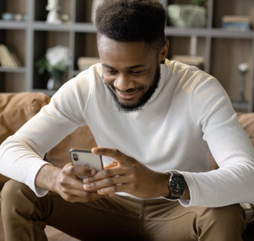 a man looking down at his phone